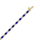 14K YELLOW GOLD 6 7/8CT ROUND/OVAL DIAMOND LADIES BRACELET (BLUE SAPPHIRE OVAL 6 1/6CT)