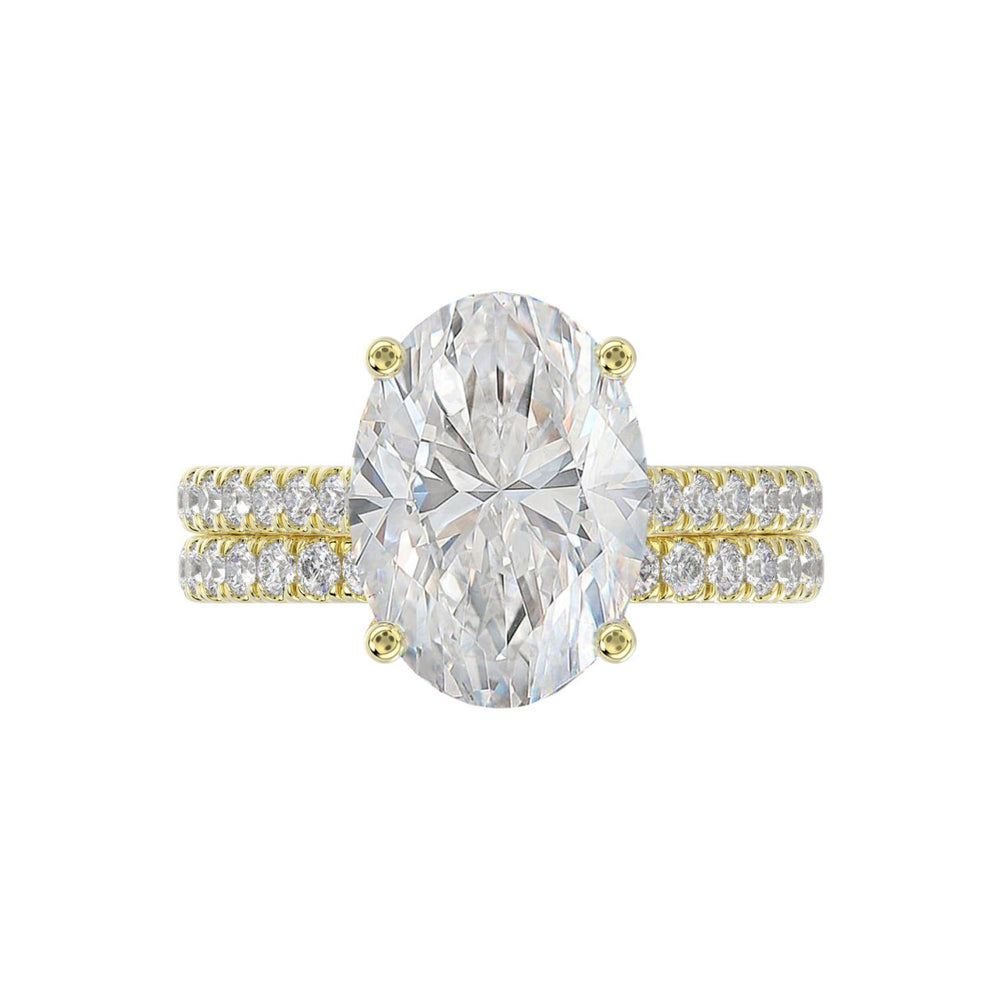 14K YELLOW GOLD 4 1/2CT ROUND/OVAL DIAMOND LADIES BRIDAL SET (CENTER STONE OVAL DIAMOND 4.00CT)